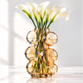 LOVINAYIY Amber Bubble Glass Vase - unique sculptural form top view with calla lilies